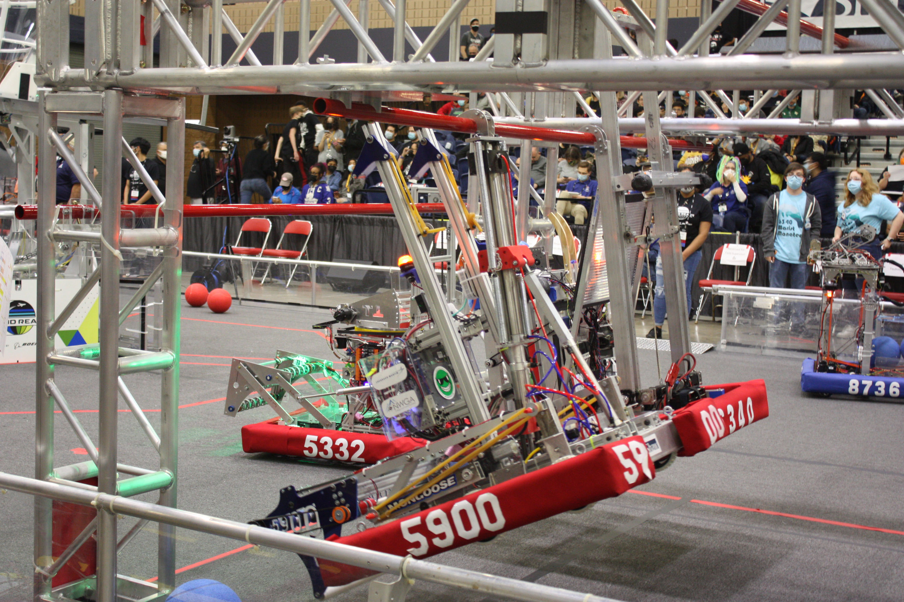 The Career Blazer Robotics - Fighting Mongooses from the Northwest Georgia Career Academy score points when the team’s robot hangs from a bar during a qualification match.
