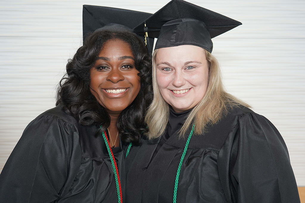 Kia Moore (left) and Kaitlan Turner pose for a picture before GNTC’s 2023 Adult Education Spring Commencement Ceremony.  