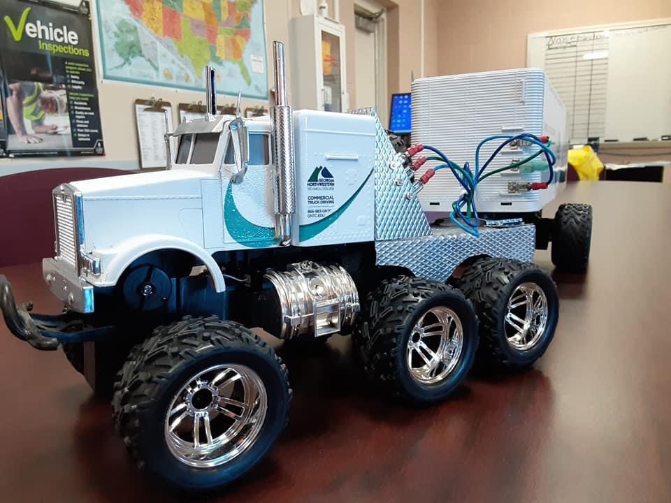 This four-wheel drive RC tractor-trailer was restored by 15-year-old Elijah Knox, son of GNTC graduate Joshua Knox. The truck back was wrapped to look like one of the tractor-trailers driven by students in GNTC's Commercial Truck Driving program.