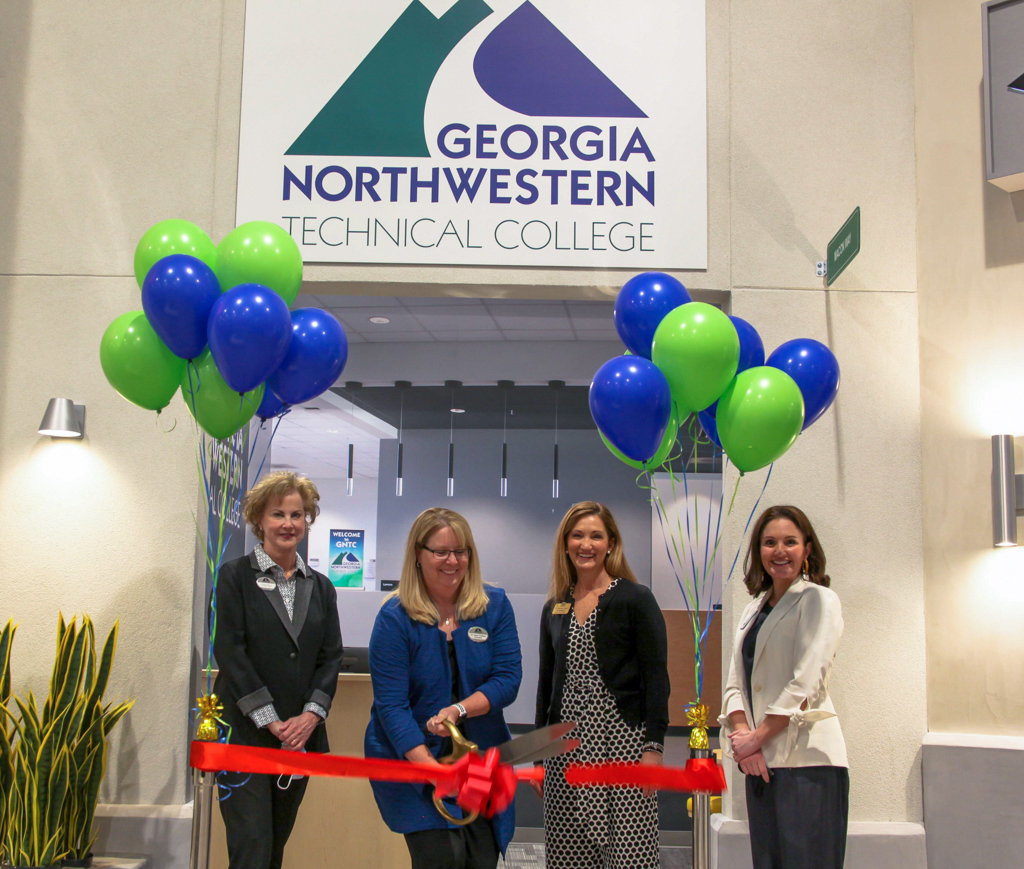On March 24, 2021, Georgia Northwestern Technical College held a ribbon cutting ceremony to display the college’s new storefront housed inside the Junior Achievement (JA) Discovery Center of Greater Dalton. From left to right: Sherrie Patterson, chair of GNTC Foundation Board of Trustees, GNTC President Dr. Heidi Popham, Dr. Michele Taylor, chair of GNTC’s Board of Directors and Anna Adamson, Junior Achievement of Georgia director of development for northwest Georgia. 