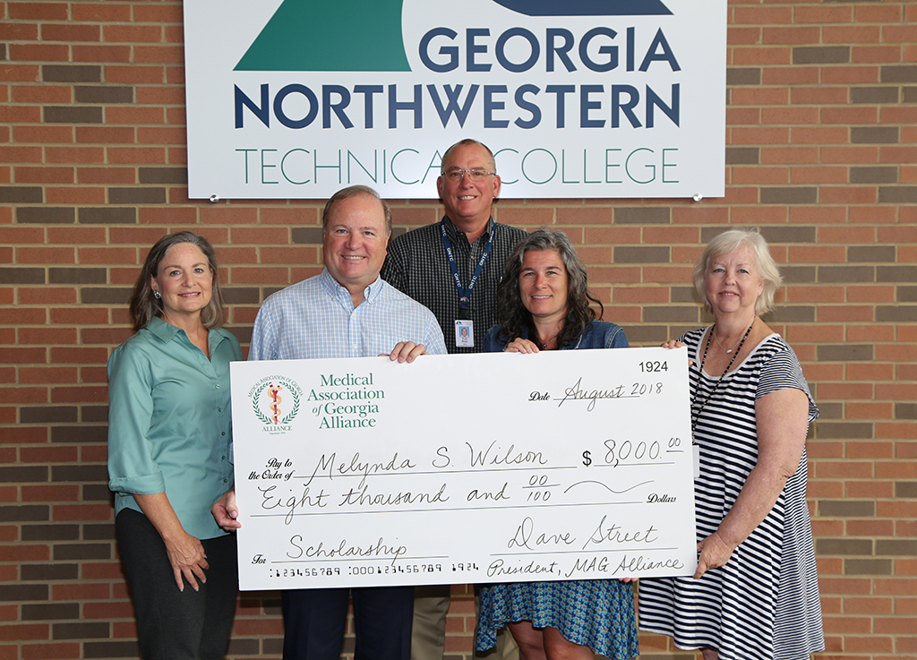 The Medical Association of Georgia (MAG) Alliance presented a GNTC student with an $8,000 scholarship at the Gordon County Campus. (From left to right) Merrilee Gober, MAG Alliance member; Dave Street, president of the MAG Alliance; Tom Bojo, dean of Public Service Technology at GNTC; Melynda Wilson, scholarship recipient; and Kathy Kerce, director of the Lactation Consultant program at GNTC.