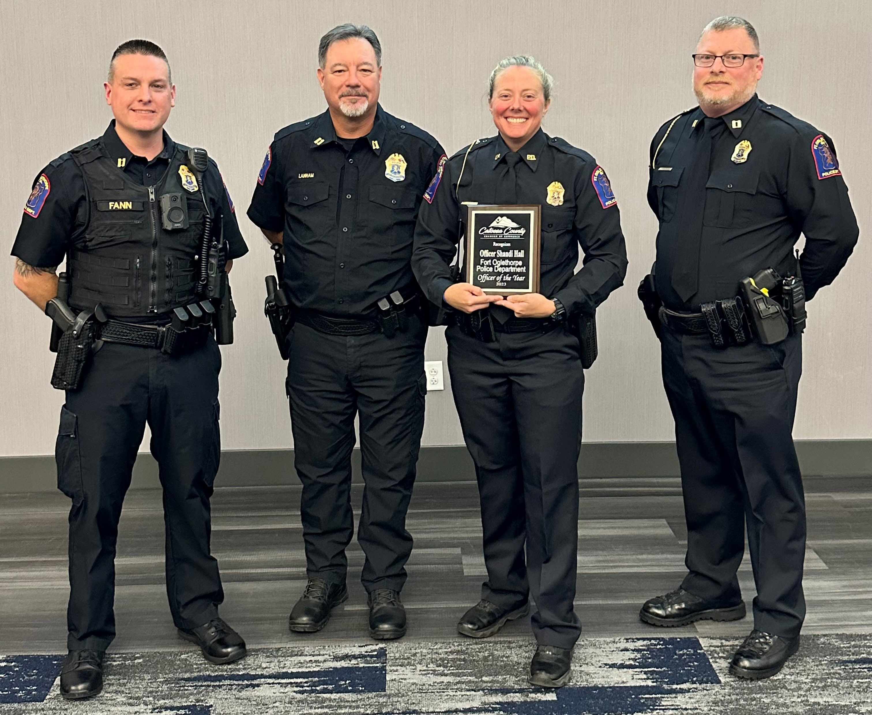 The Catoosa County Chamber of Commerce named Shandi Hall (second from right) as its Officer of the Year for 2023. (from left) Fort Oglethorpe Police Capts. Shane Fann, John Lanham and Brian Stooksbury present Hall with the award.