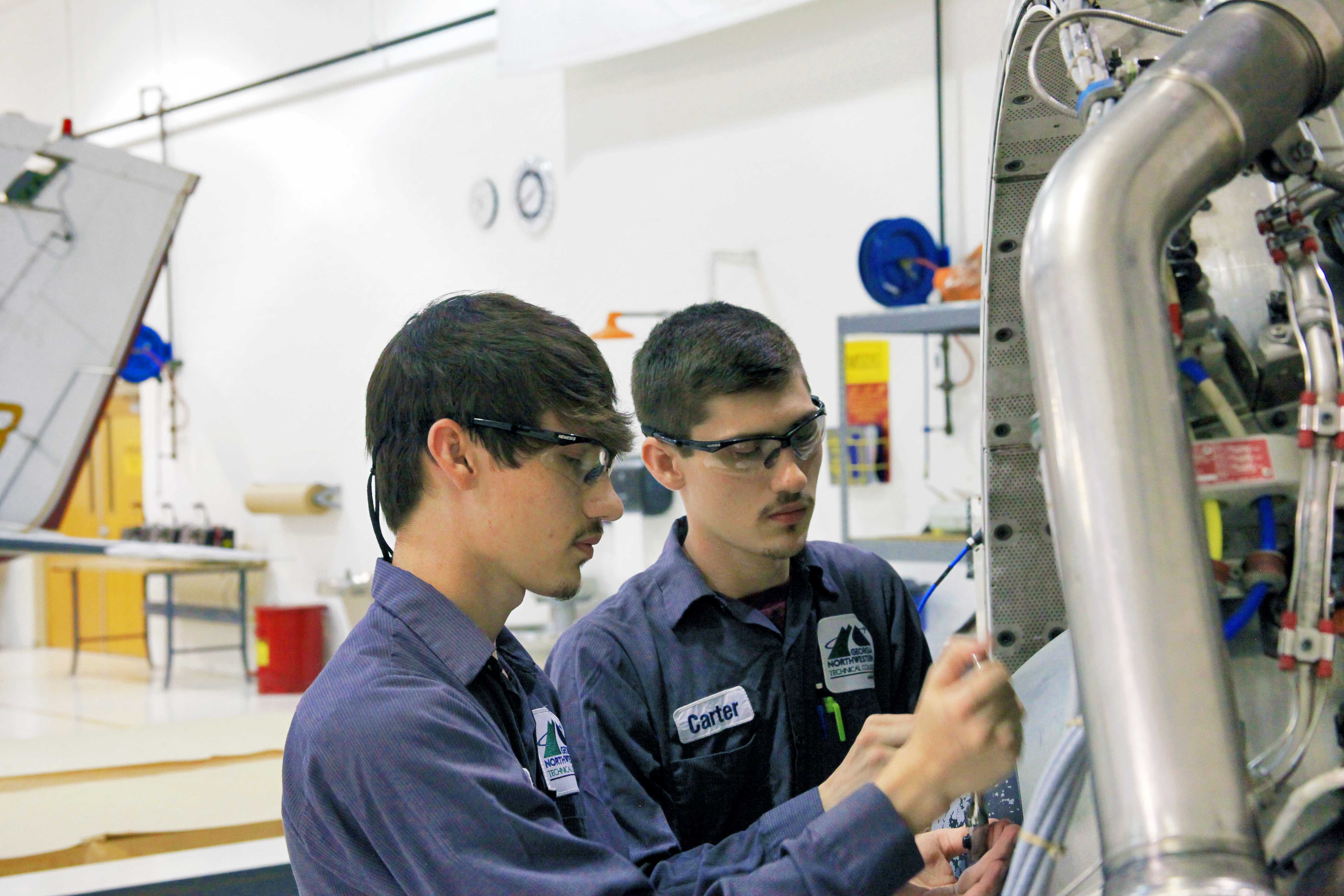 Cade (left) and Carter Shelton carefully disassembled the blades of a turbine engine at GNTC’s Aviation Training Center. The identical twins are now graduates of GNTC’s Aviation Maintenance Technology program and are fully certified through the FAA to work on aircraft of all sizes. 